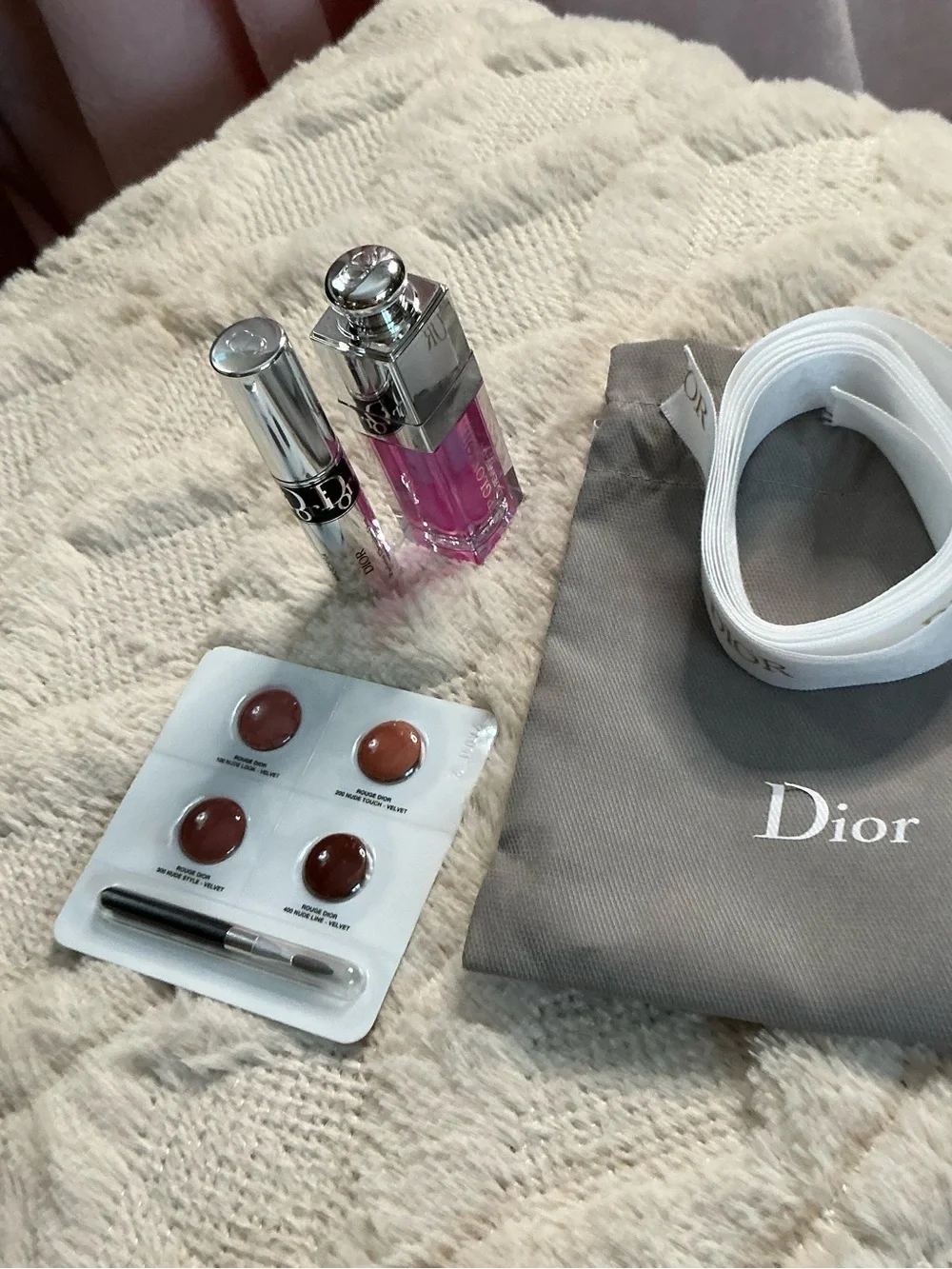 Dior White Logo Ribbon with Gray Pouch and Pink Lip Gloss Accent